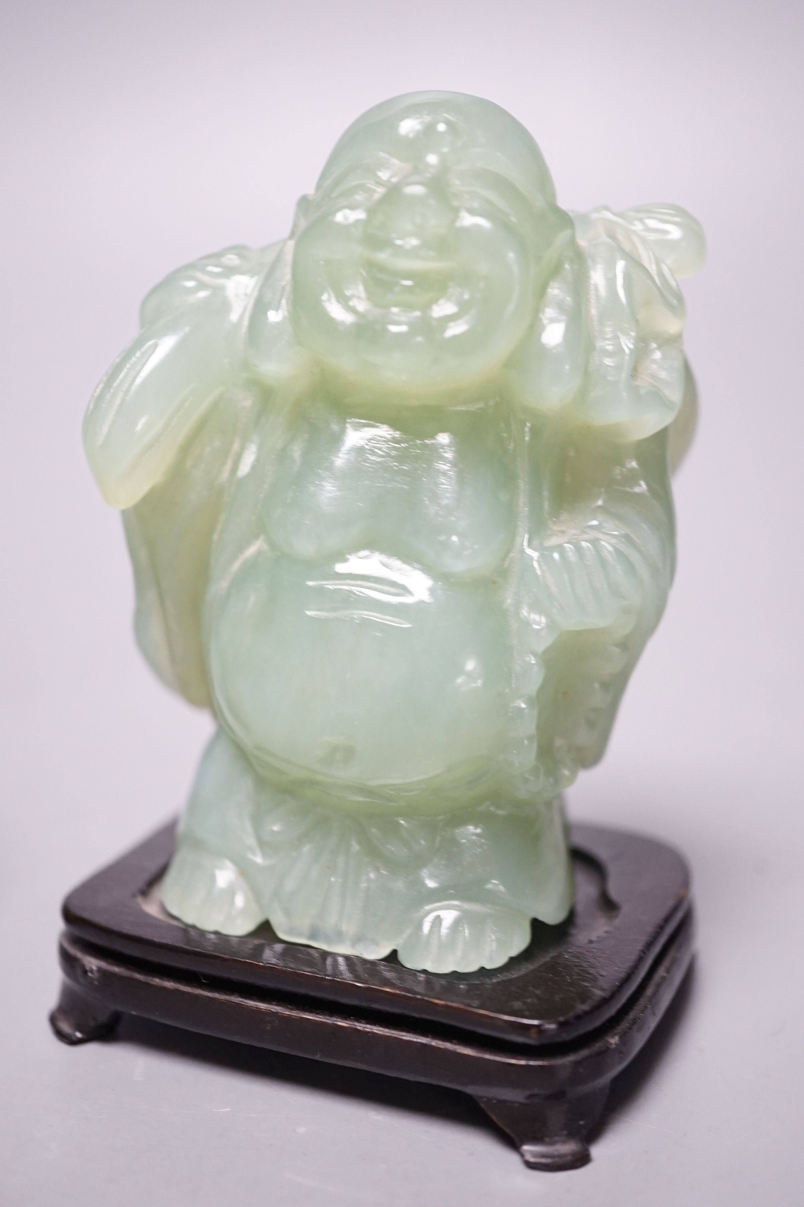Two bowenite carvings of an elephant and Budai, wood stands, tallest, 9.5cm